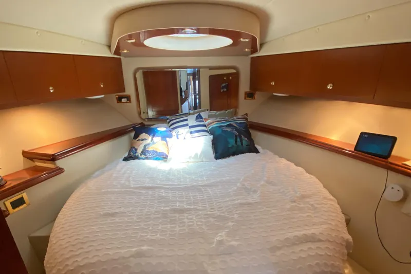 Dianne Yacht Photos Pics Luxurious cabin interior of 2003 Bluewater Yachts 6000 custom series with cozy bedding.