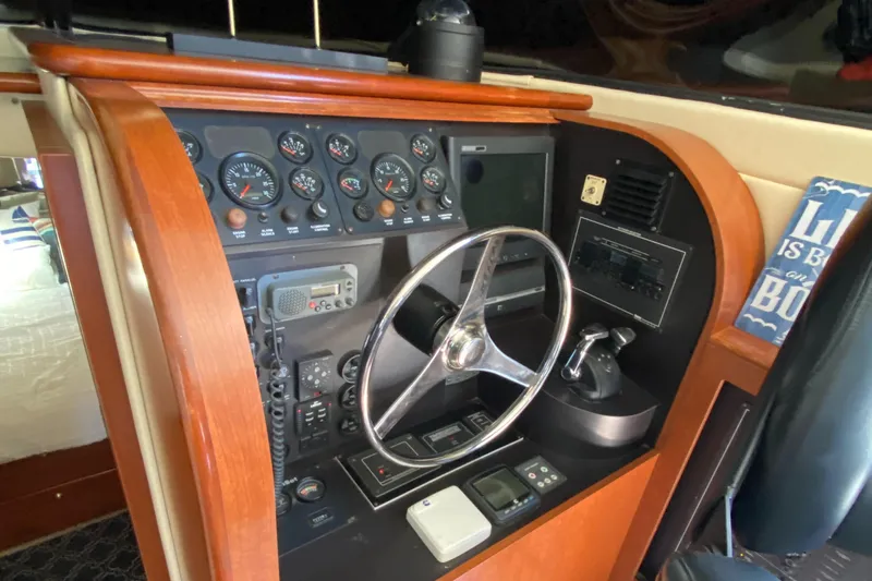 Dianne Yacht Photos Pics 2003 Bluewater Yachts 6000 custom series helm with gauges, steering wheel, and controls.