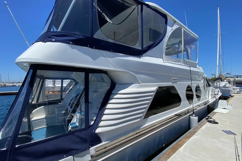 Dianne Yacht Photos Pics 2003 Bluewater Yachts 6000 Custom Series docked at marina under clear blue sky.