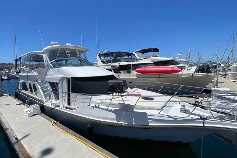 Dianne Yacht Photos Pics 2003 Bluewater Yachts 6000 Custom Series docked at marina under clear blue sky.