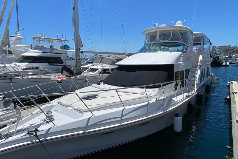 Dianne Yacht Photos Pics 2003 Bluewater Yachts 6000 Custom Series docked at marina, surrounded by other boats.