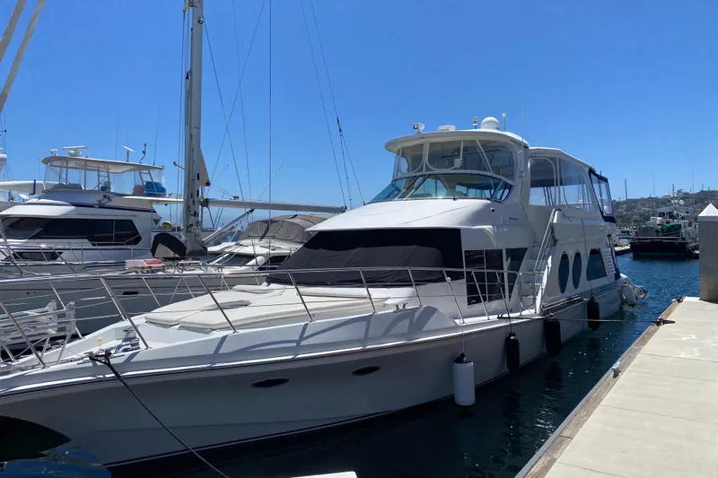 Dianne Yacht Photos Pics 2003 Bluewater Yachts 6000 Custom Series docked at marina under clear blue sky.