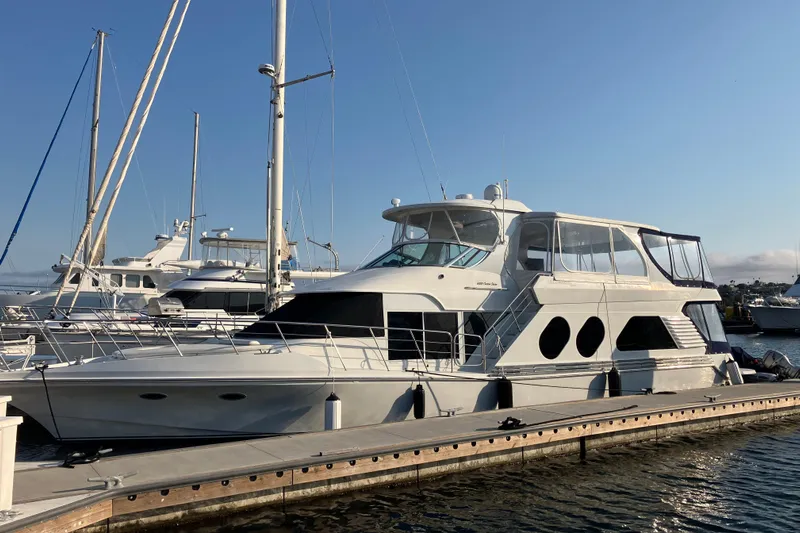 Dianne Yacht Photos Pics 2003 Bluewater Yachts 6000 Custom Series docked at marina under clear blue sky.