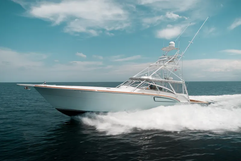 Reel Tycoon Yacht Photos Pics 2004 Donzi R-58 Express yacht cruising on open water.