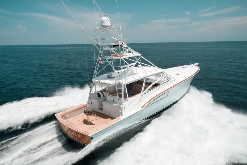 Reel Tycoon Yacht Photos Pics 2004 Donzi R-58 Express yacht cruising on open water.