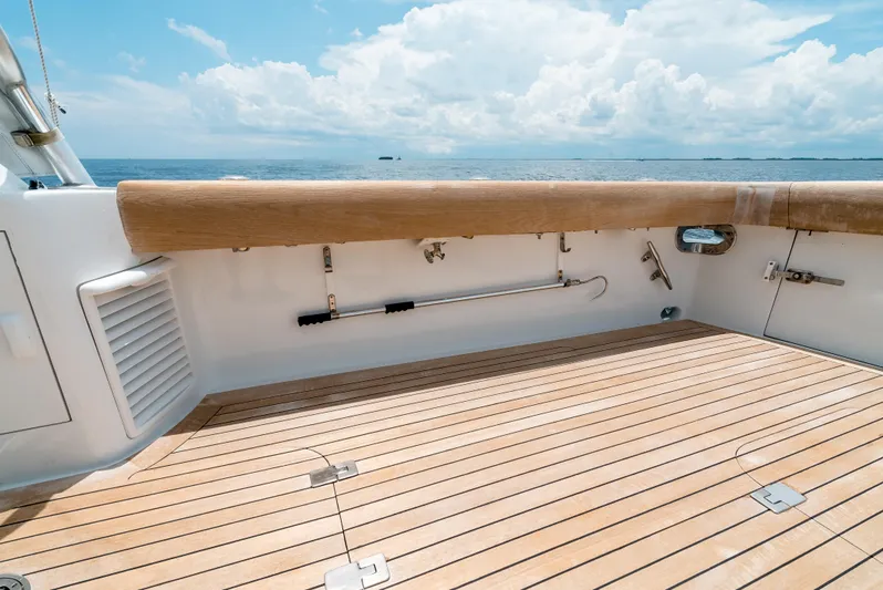 Reel Tycoon Yacht Photos Pics 2004 Donzi R-58 Express boat deck with ocean view and wooden flooring.