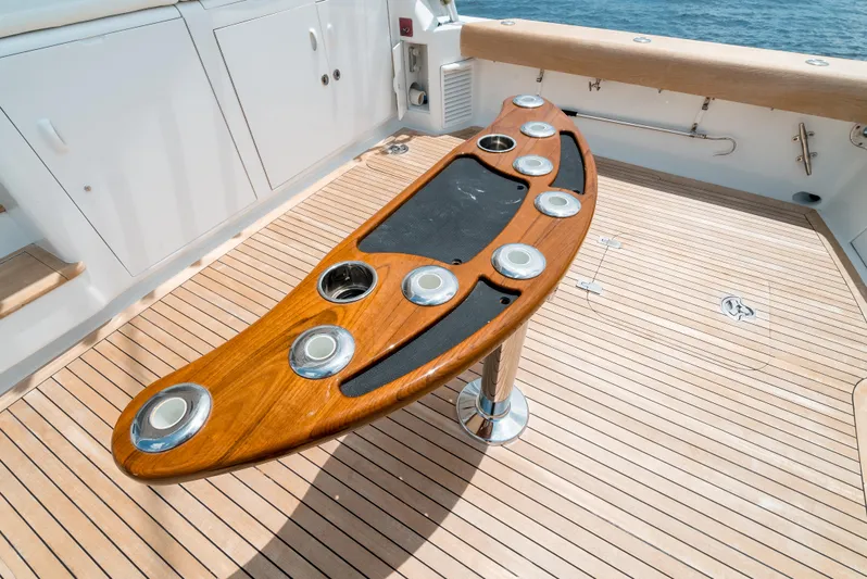 Reel Tycoon Yacht Photos Pics Wooden fishing rod holder on 2004 Donzi R-58 Express yacht deck.
