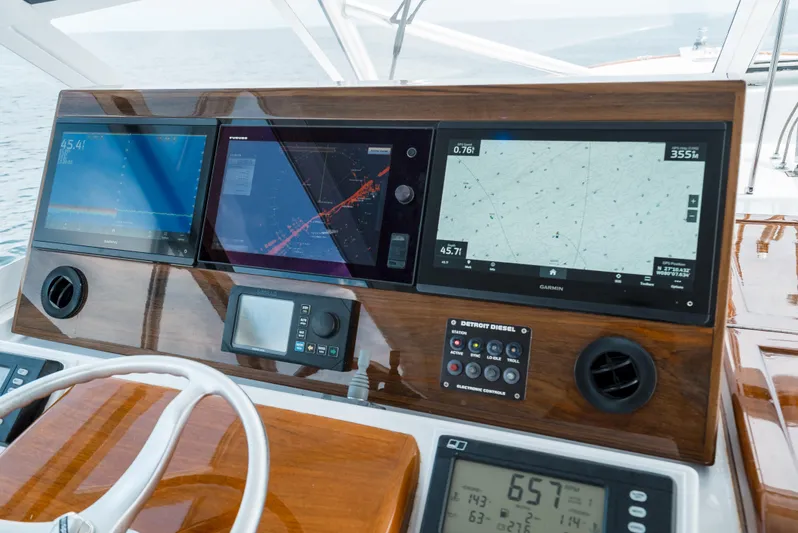 Reel Tycoon Yacht Photos Pics Dashboard of 2004 Donzi R-58 Express with navigation screens and controls.