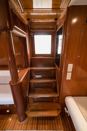 Reel Tycoon Yacht Photos Pics Interior of 2004 Donzi R-58 Express yacht with wooden stairs and elegant design.