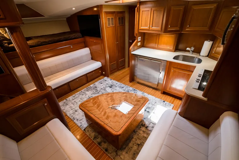 Reel Tycoon Yacht Photos Pics Luxurious 2004 Donzi R-58 Express yacht interior with elegant wood finishes and modern amenities.