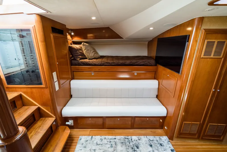 Reel Tycoon Yacht Photos Pics Luxurious 2004 Donzi R-58 Express yacht interior with wooden finishes and cozy seating.