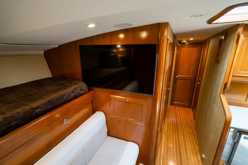 Reel Tycoon Yacht Photos Pics Luxurious interior of 2004 Donzi R-58 Express yacht with wood paneling and modern amenities.