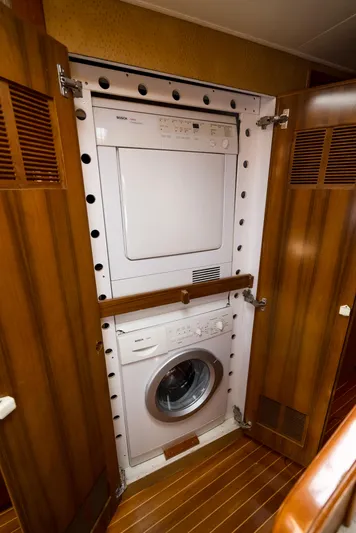 Reel Tycoon Yacht Photos Pics Stacked washer and dryer in 2004 Donzi R-58 Express yacht interior.