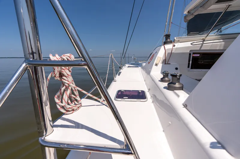 Atlas Yacht Photos Pics Sailing yacht deck of 2006 St Francis SF50, featuring ropes and winches under clear blue sky.