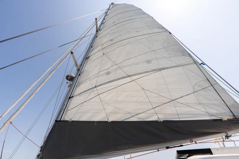 Atlas Yacht Photos Pics Sail of 2006 St Francis SF50 catamaran against clear blue sky.