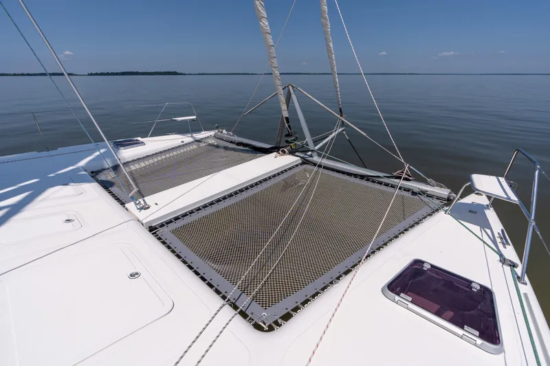 Atlas Yacht Photos Pics St Francis SF50 catamaran deck with netting, calm waters, clear sky, 2006 model.