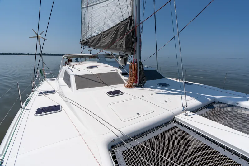 Atlas Yacht Photos Pics Sailing catamaran St Francis SF50, 2006 model, on calm waters under clear blue sky.