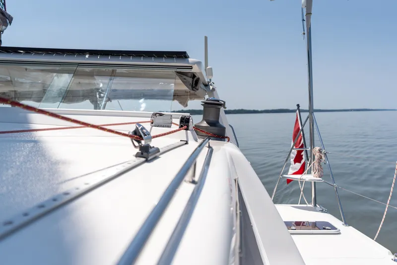 Atlas Yacht Photos Pics Sailing yacht St Francis SF50, 2006 model, with Canadian flag on calm waters.
