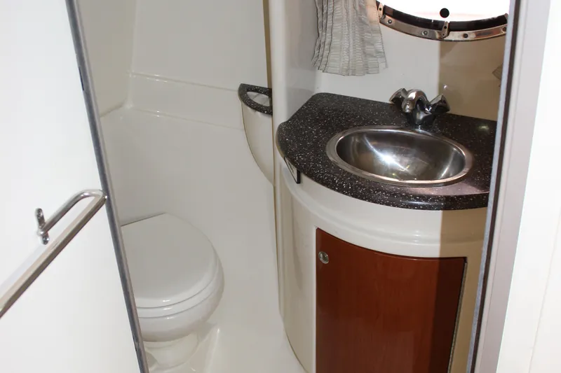  Yacht Photos Pics 2008 Formula 34 Performance Cruiser bathroom with sink, toilet, and porthole window.