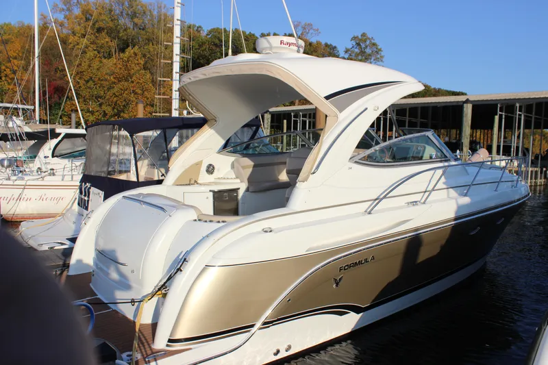  Yacht Photos Pics 2008 Formula 34 Performance Cruiser docked at marina, surrounded by other boats.