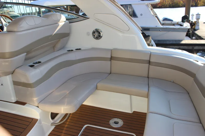  Yacht Photos Pics 2008 Formula 34 Performance Cruiser interior with beige seating and wood flooring.