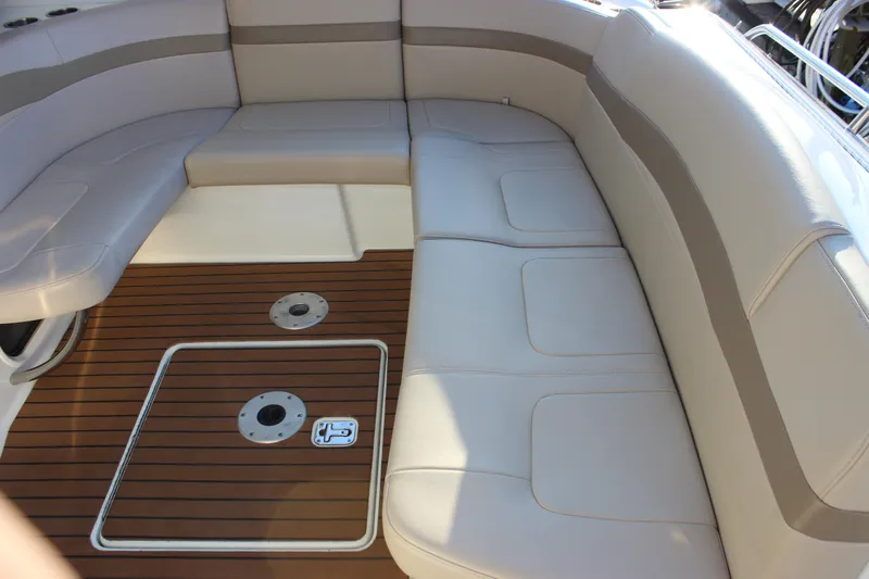  Yacht Photos Pics 2008 Formula 34 Performance Cruiser interior with beige seating and teak flooring.