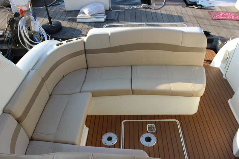  Yacht Photos Pics 2008 Formula 34 Performance Cruiser interior with beige seating and teak flooring.