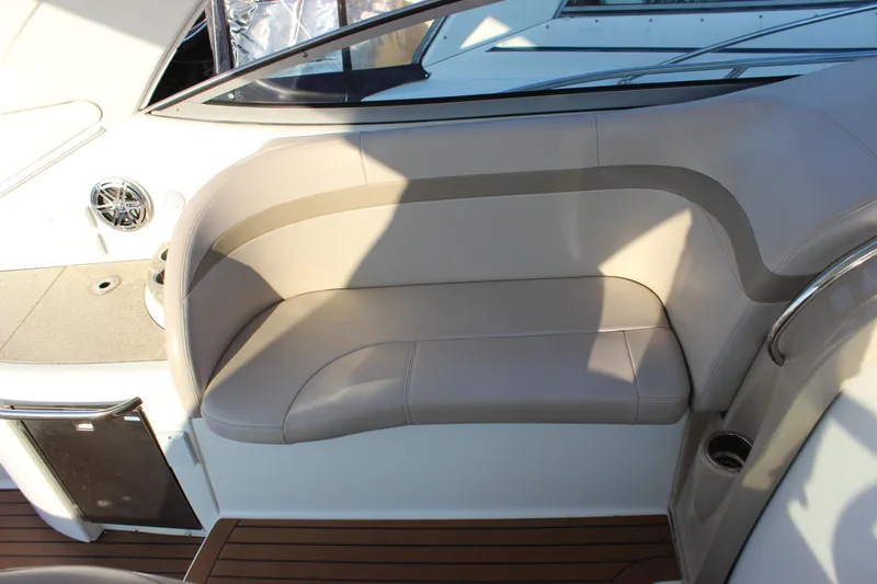 Yacht Photos Pics 2008 Formula 34 Performance Cruiser interior seating with beige upholstery and wood flooring.