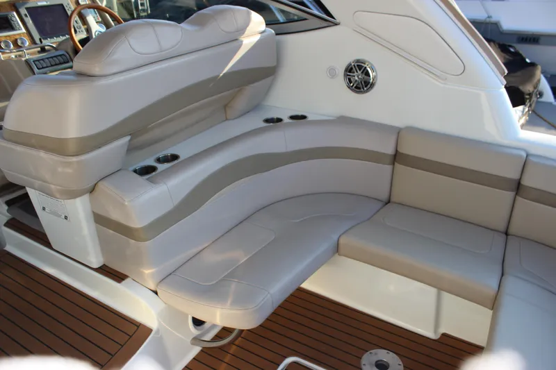  Yacht Photos Pics 2008 Formula 34 Performance Cruiser interior with beige seating and wood flooring.
