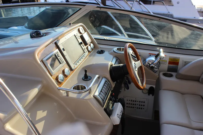  Yacht Photos Pics 2008 Formula 34 Performance Cruiser helm with steering wheel and navigation controls.