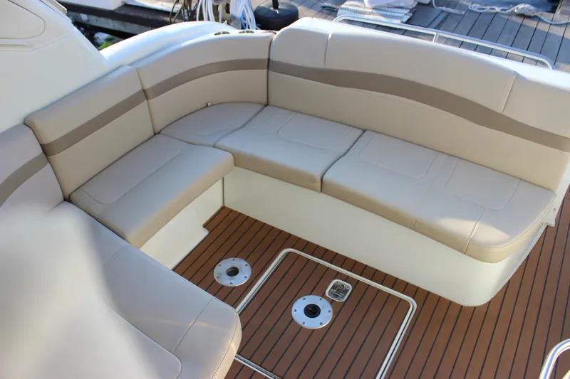  Yacht Photos Pics 2008 Formula 34 Performance Cruiser interior with beige seating and teak flooring.