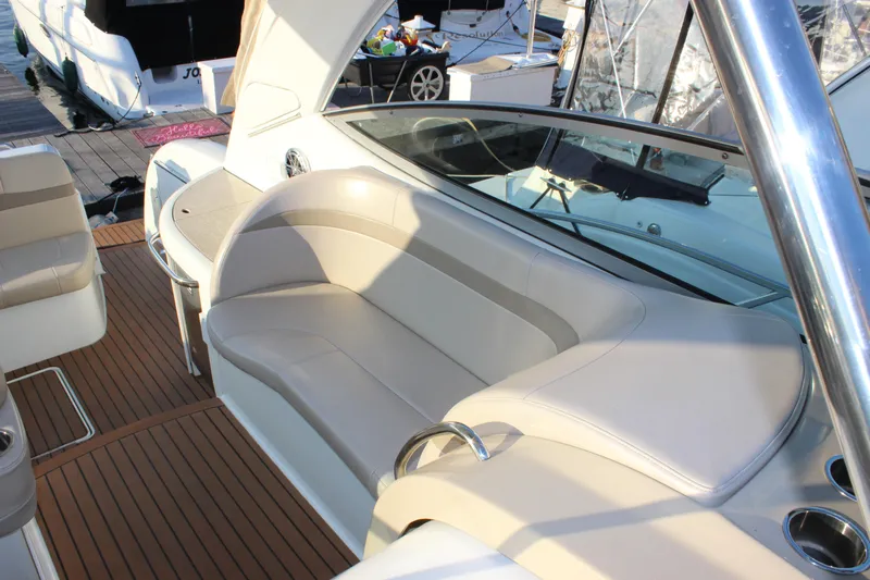  Yacht Photos Pics 2008 Formula 34 Performance Cruiser interior with beige seating and wood-style flooring.