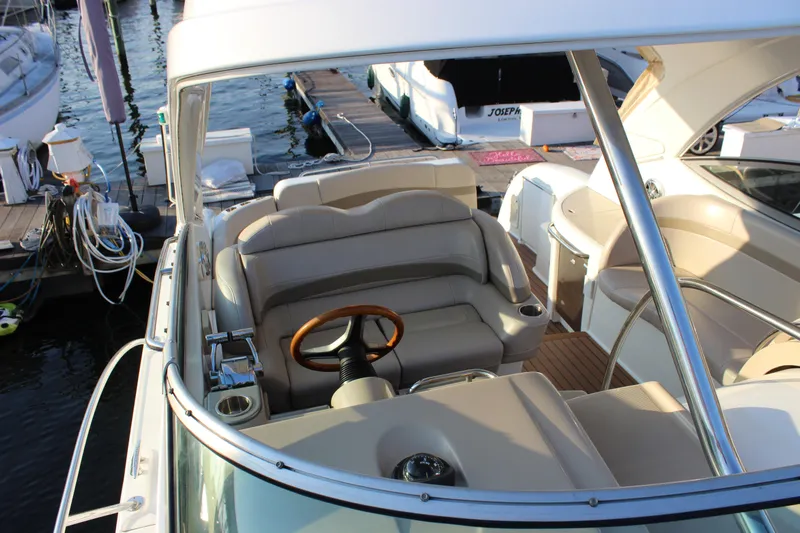  Yacht Photos Pics 2008 Formula 34 Performance Cruiser interior with helm, leather seating, and wooden steering wheel.