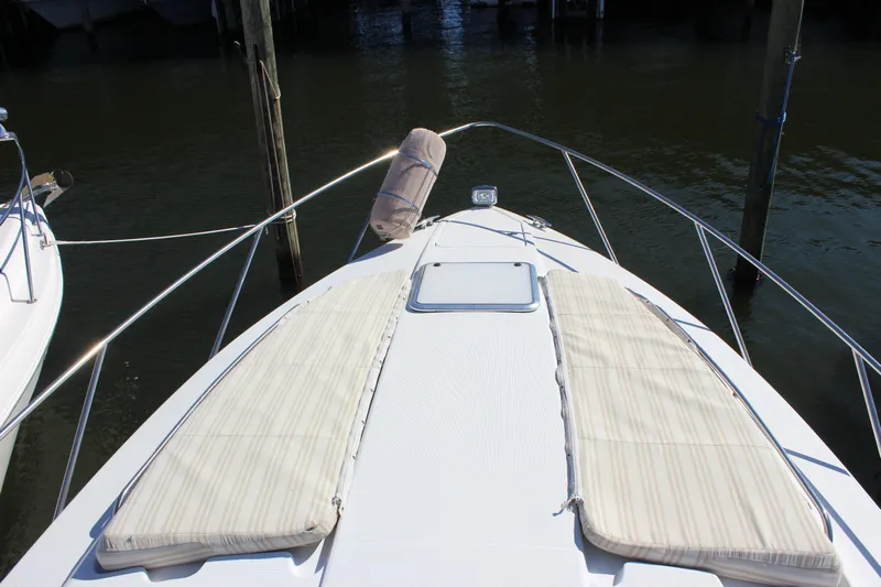  Yacht Photos Pics 2008 Formula 34 Performance Cruiser bow with sun pads, docked in calm waters.