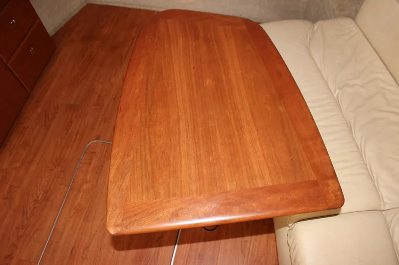  Yacht Photos Pics Wooden table in 2008 Formula 34 Performance Cruiser interior, next to beige seating.
