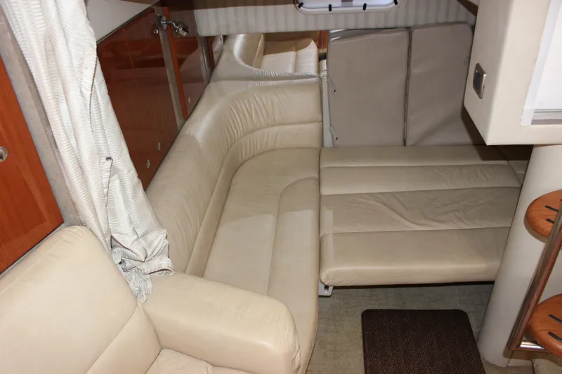  Yacht Photos Pics 2008 Formula 34 Performance Cruiser interior with beige leather seating and wooden accents.