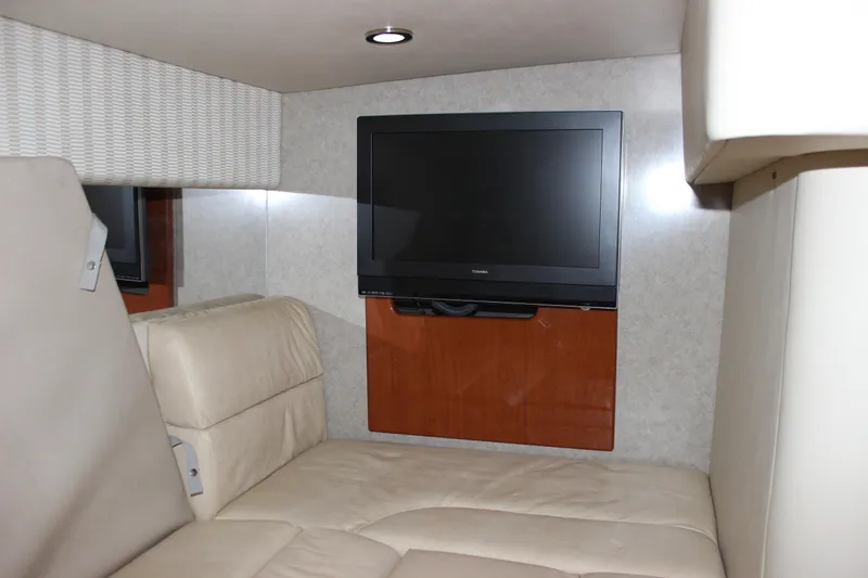  Yacht Photos Pics Interior of 2008 Formula 34 Performance Cruiser with TV and beige seating.