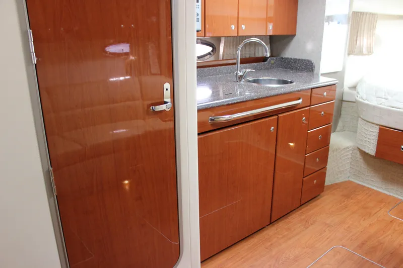  Yacht Photos Pics 2008 Formula 34 Performance Cruiser interior with wood cabinetry and modern kitchen amenities.