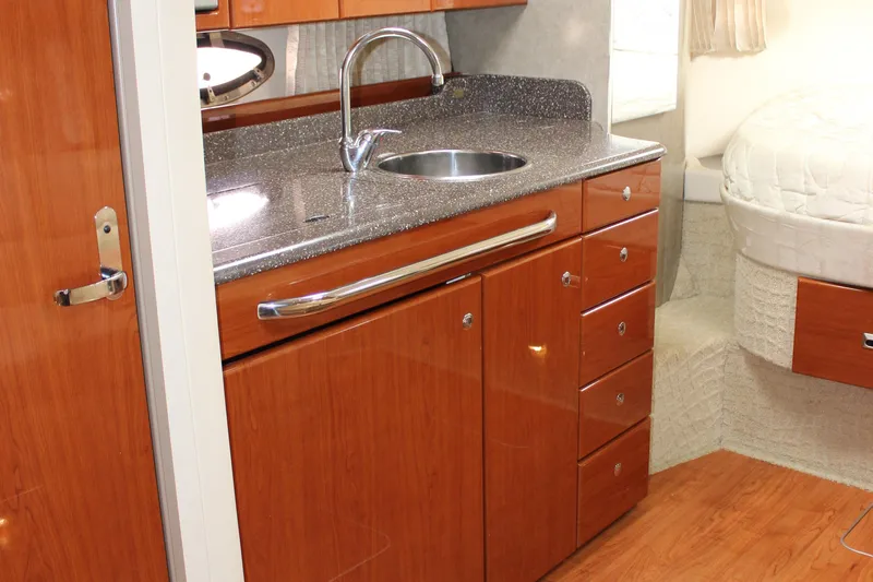  Yacht Photos Pics 2008 Formula 34 Performance Cruiser interior with sleek wood cabinetry and modern sink.