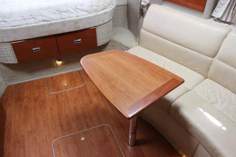  Yacht Photos Pics Interior of 2008 Formula 34 Performance Cruiser with wood table and beige seating.