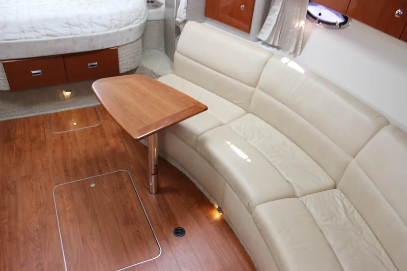  Yacht Photos Pics 2008 Formula 34 Performance Cruiser interior with beige leather seating and wooden table.