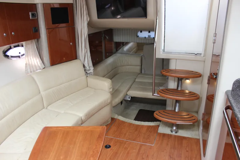  Yacht Photos Pics Interior of 2008 Formula 34 Performance Cruiser with beige seating and wooden accents.
