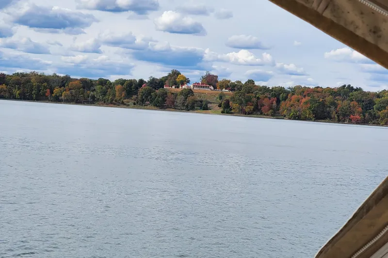  Yacht Photos Pics Lake view from a 2008 Formula 34 Performance Cruiser, with autumn trees and cloudy sky.