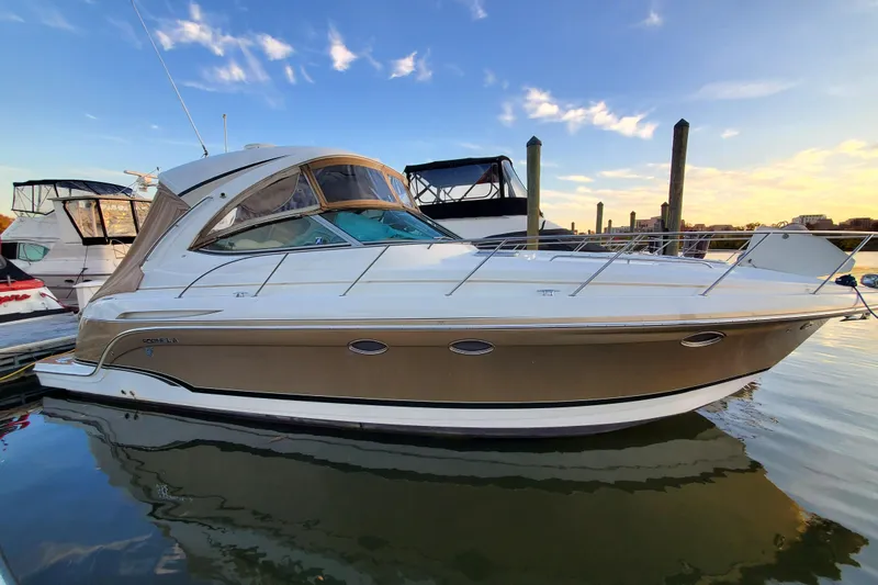  Yacht Photos Pics 2008 Formula 34 Performance Cruiser docked at sunset, reflecting on calm water.