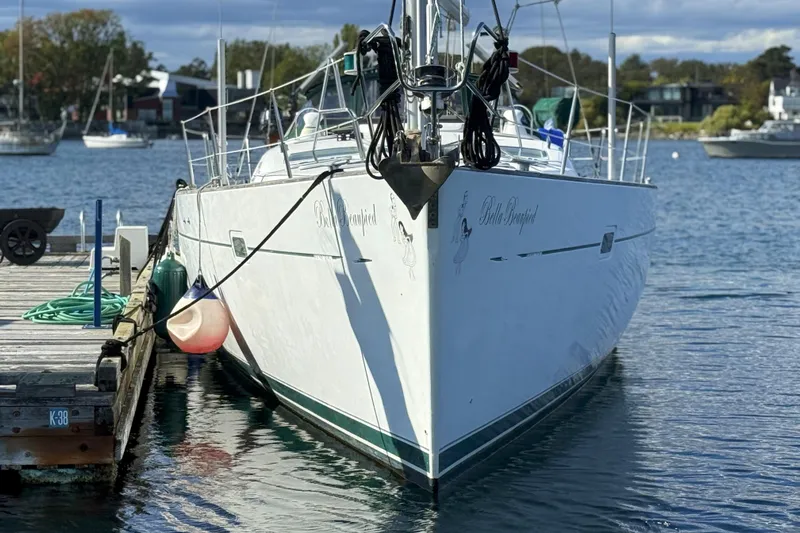 Bellabeaupied Yacht Photos Pics 2004 Beneteau 473 sailboat docked at a marina, calm water, clear sky.