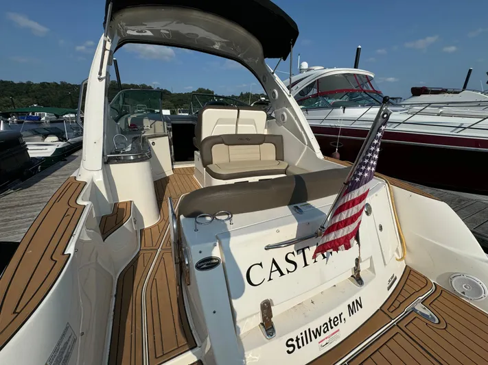  Yacht Photos Pics 2014 Sea Ray 330 Sundancer boat docked, featuring teak flooring and American flag, Stillwater, MN.