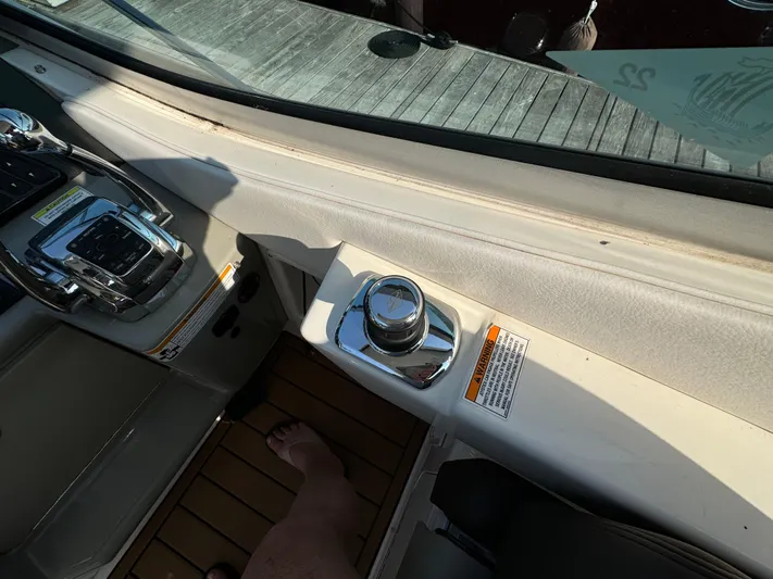  Yacht Photos Pics 2014 Sea Ray 330 Sundancer helm with controls and joystick on teak flooring.