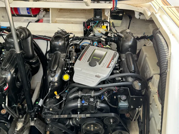  Yacht Photos Pics Engine compartment of a 2014 Sea Ray 330 Sundancer boat, showcasing detailed mechanical components.