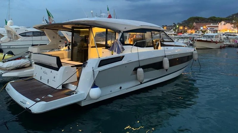  Yacht Photos Pics 2019 Jeanneau NC 37 yacht docked at marina during evening.