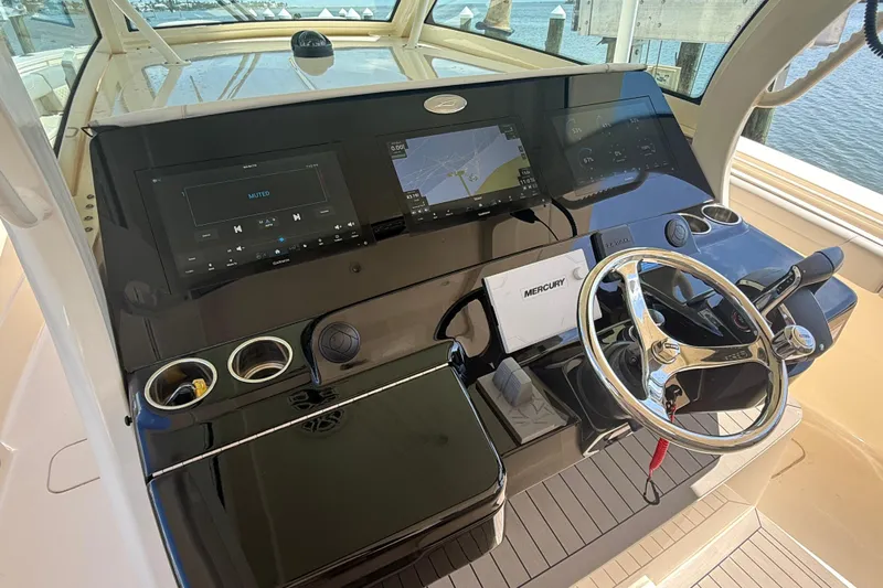  Yacht Photos Pics Helm of 2022 Scout 425 LXF boat with modern navigation and control systems.